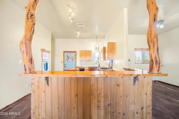 a kitchen with a stove and a refrigerator