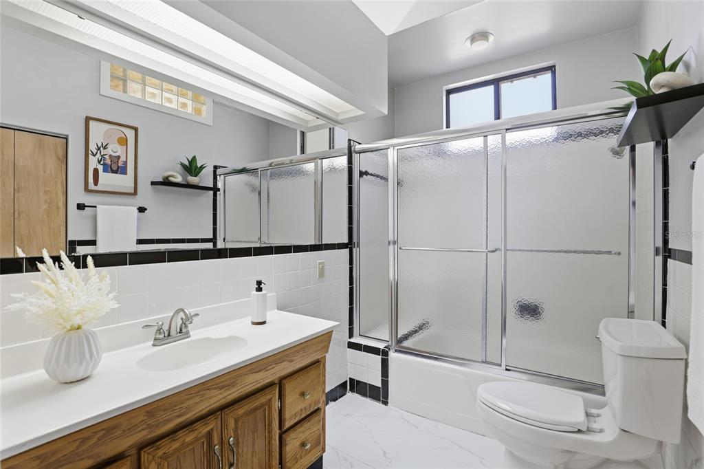 216 Northeast 6th Street Gainesville, FL 32601 - Photo 20 of 36 a bathroom with a sink toilet and shower