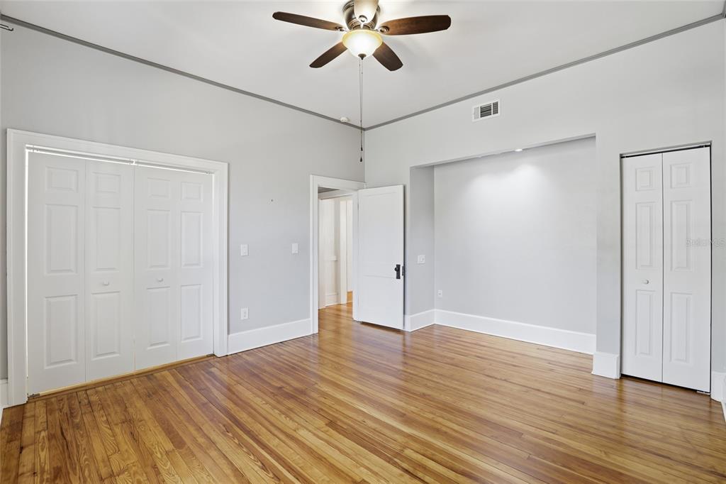 216 Northeast 6th Street Gainesville, FL 32601 - Photo 22 of 36 a view of an empty room and wooden floor