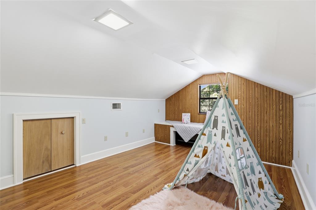 216 Northeast 6th Street Gainesville, FL 32601 - Photo 28 of 36 a view of a livingroom with wooden floor and staircase