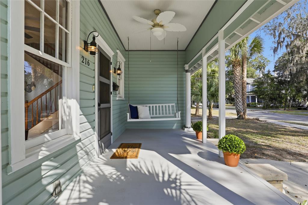 216 Northeast 6th Street Gainesville, FL 32601 - Photo 3 of 36 a view of a patio with table and chairs potted plants