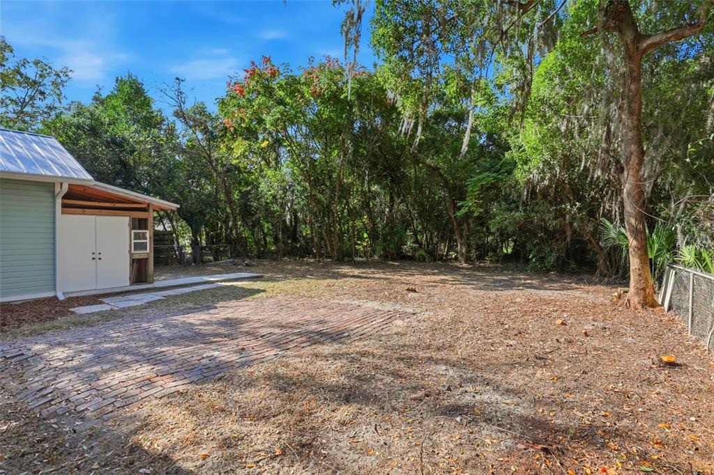 216 Northeast 6th Street Gainesville, FL 32601 - Photo 35 of 36 a backyard of a house with lots of green space