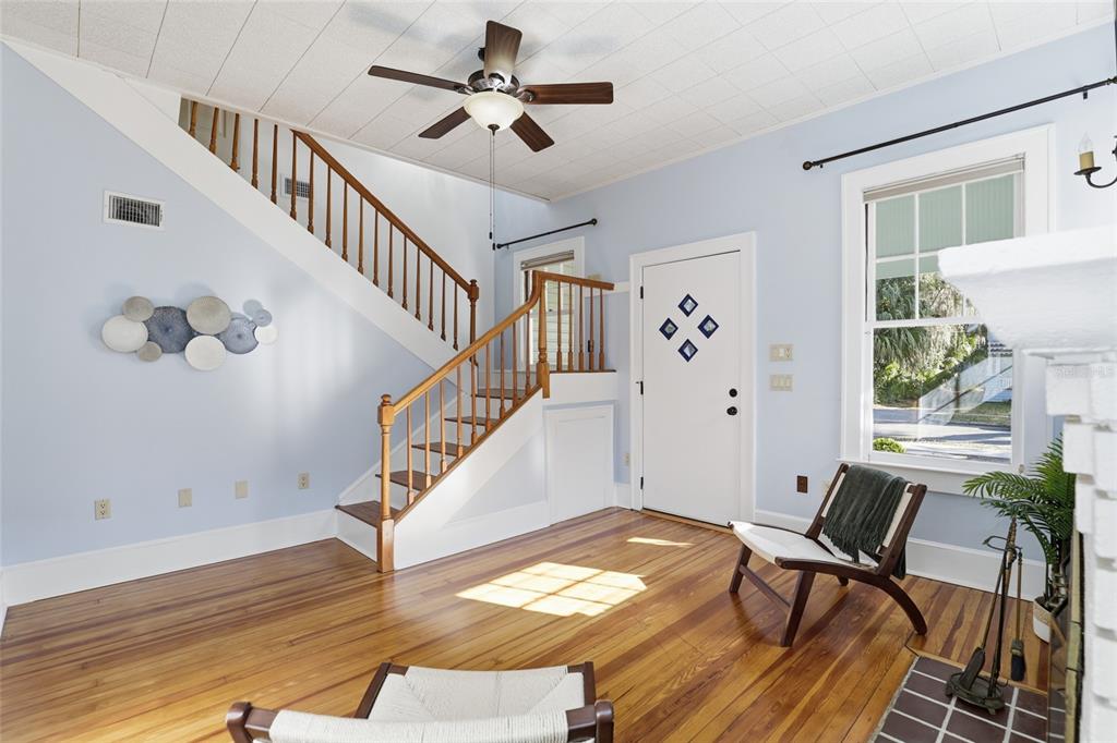 216 Northeast 6th Street Gainesville, FL 32601 - Photo 6 of 36 a view of a livingroom with wooden floor and a floor to ceiling window