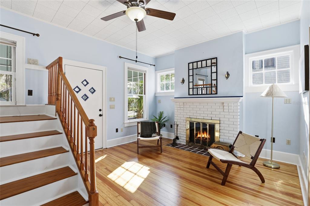 216 Northeast 6th Street Gainesville, FL 32601 - Photo 7 of 36 a living room with furniture and a fireplace