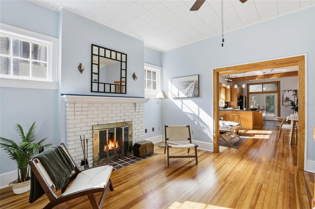 216 Northeast 6th Street Gainesville, FL 32601 - Photo 8 of 36 a living room with furniture and a fireplace