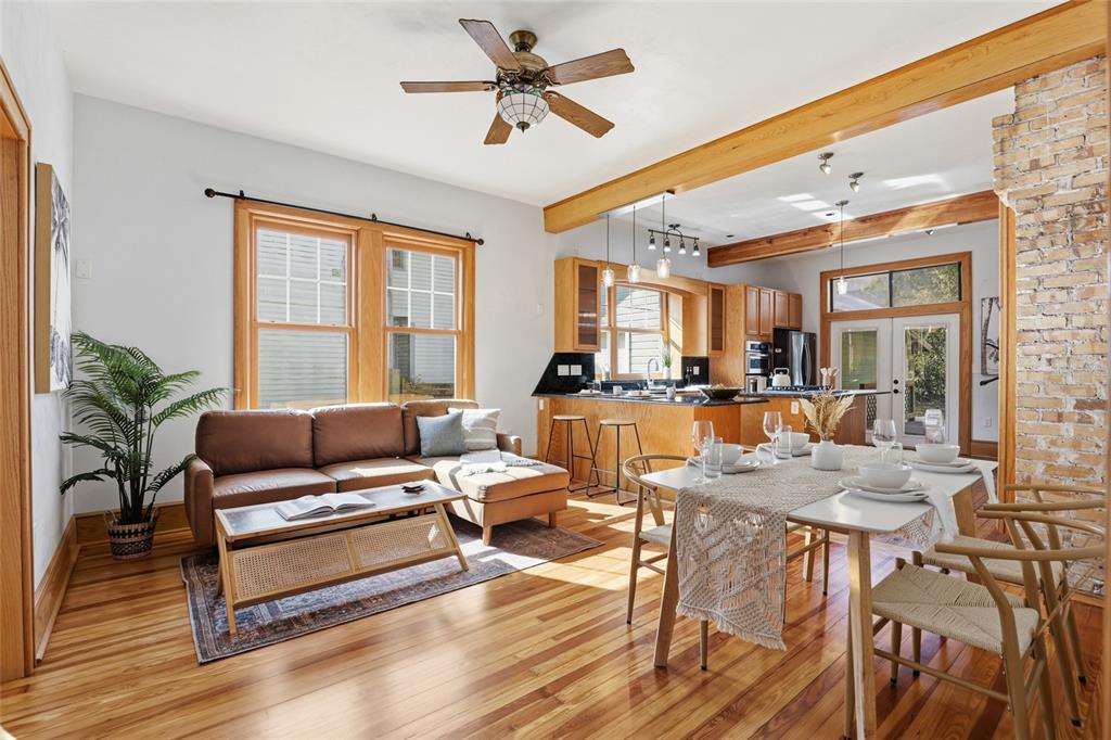 216 Northeast 6th Street Gainesville, FL 32601 - Photo 10 of 36 a living room with furniture a wooden floor and a window
