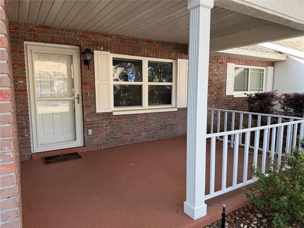 9529 Southwest 85th Avenue, Unit D Ocala, FL 34481 - Photo 2 of 21 a view of front door and porch