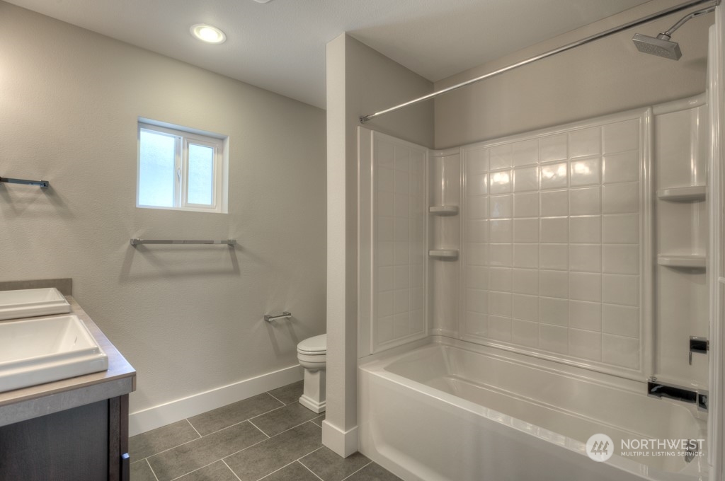 2 177th St S Street West, Unit IW 88 Bothell, WA 98012 - Photo 15 of 26 a bathroom with a bathtub a toilet and a sink