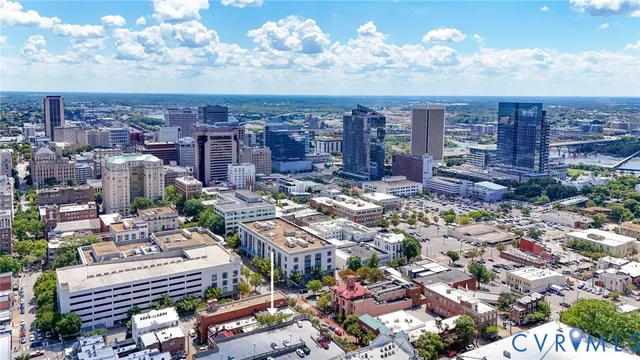 front view of a house with a yard and a fountain