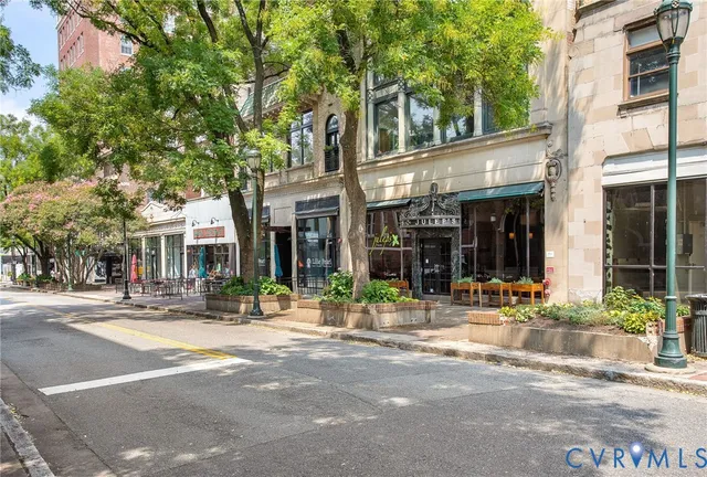 an aerial view of residential houses with city view