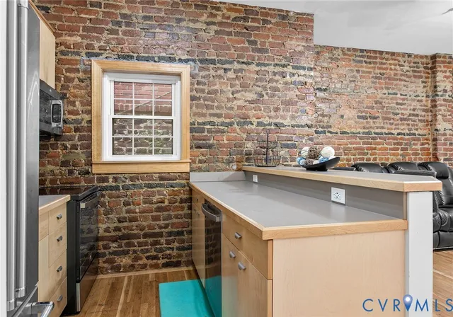 a spacious bedroom with a bed and a window