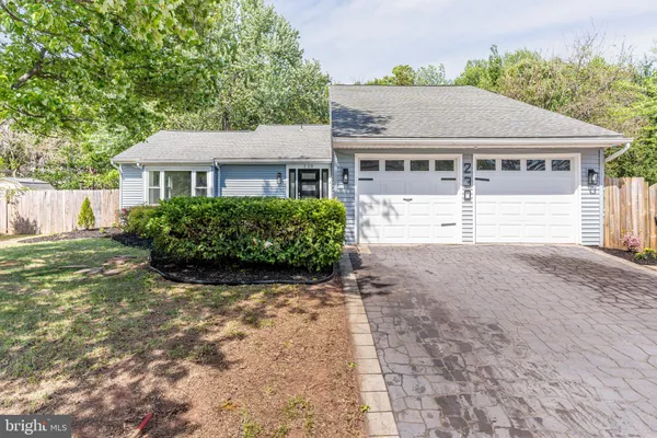 a view of house with yard and entertaining space