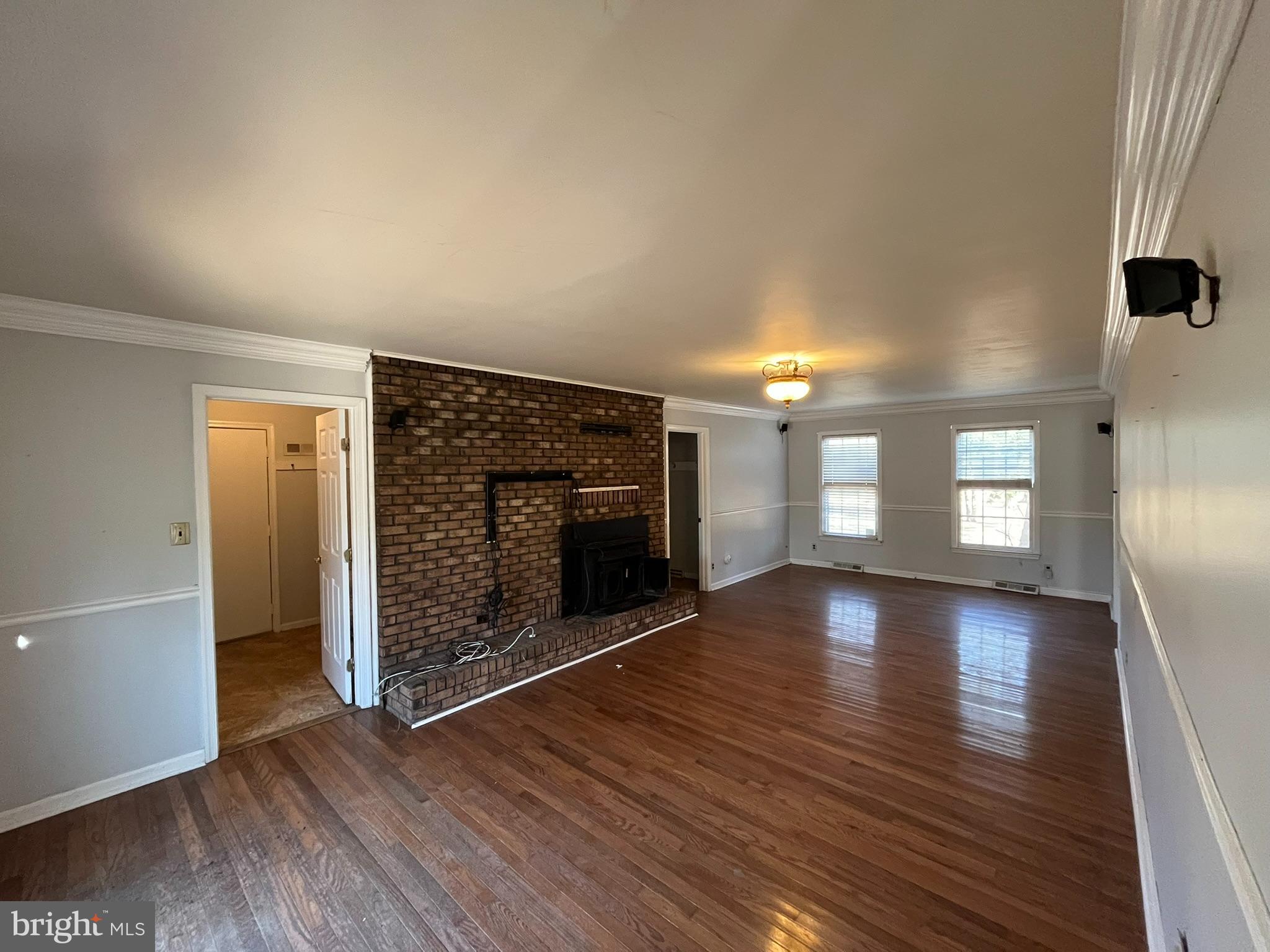 4178 Columbia Park Road Pomfret, MD 20675 - Photo 2 of 16 Spacious living area with charming brick firepl...