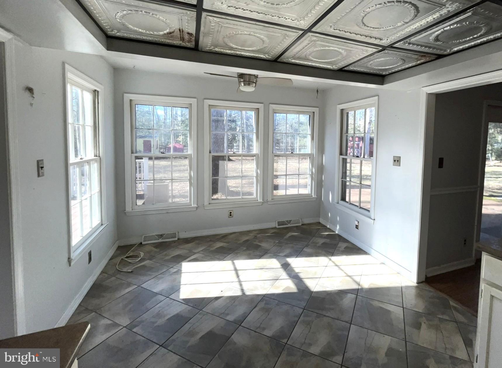 4178 Columbia Park Road Pomfret, MD 20675 - Photo 4 of 16 Bright and airy sunlit room with tile floor.