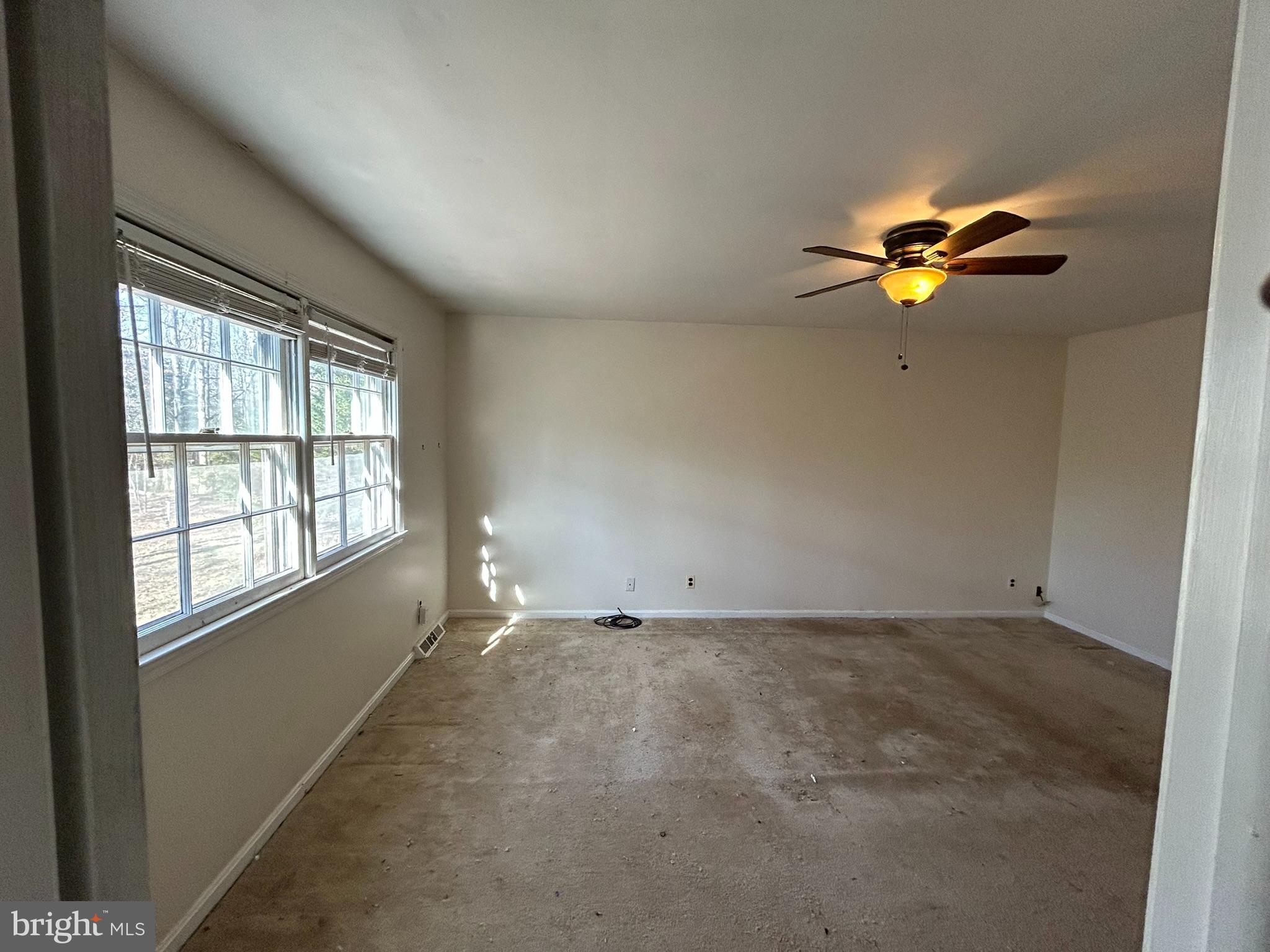 4178 Columbia Park Road Pomfret, MD 20675 - Photo 7 of 16 Spacious room with natural light and ceiling fan.