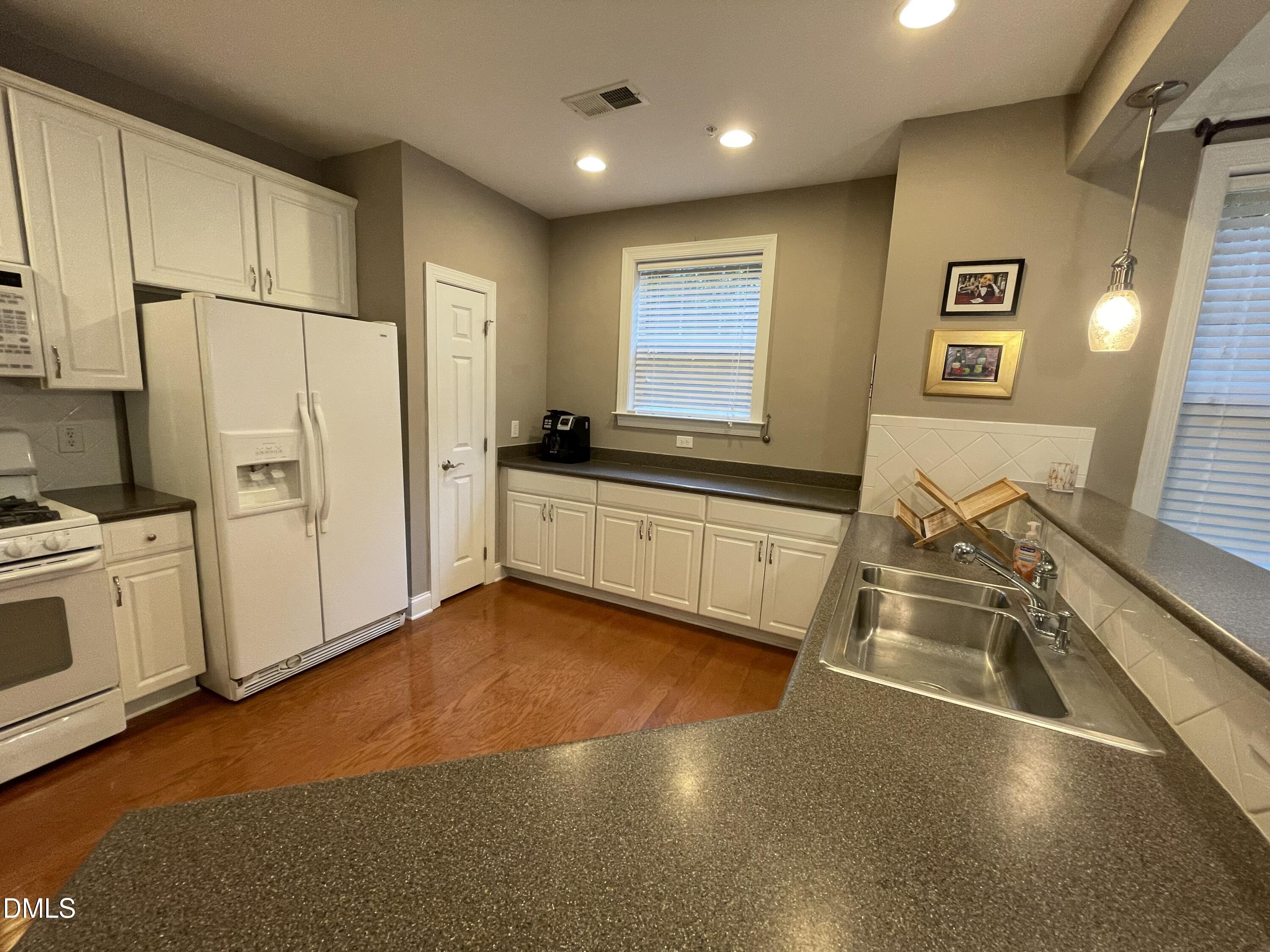 10411 Rosegate Court, Unit 3 Raleigh, NC 27617 - Photo 13 of 62 a view of a kitchen with a sink