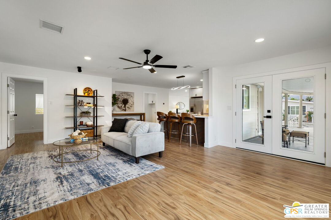 142 Capri Rancho Mirage, CA 92270 - Photo 11 of 26 a living room with furniture and wooden floor