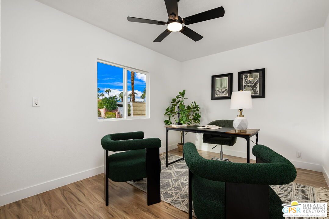 142 Capri Rancho Mirage, CA 92270 - Photo 15 of 26 a view of a workspace with furniture and a potted plant
