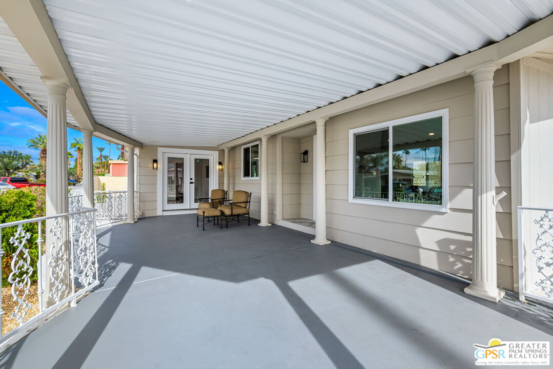 142 Capri Rancho Mirage, CA 92270 - Photo 19 of 26 a living room filled with furniture and a large window
