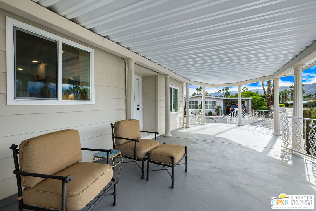 142 Capri Rancho Mirage, CA 92270 - Photo 21 of 26 a backyard of a house with table and chairs