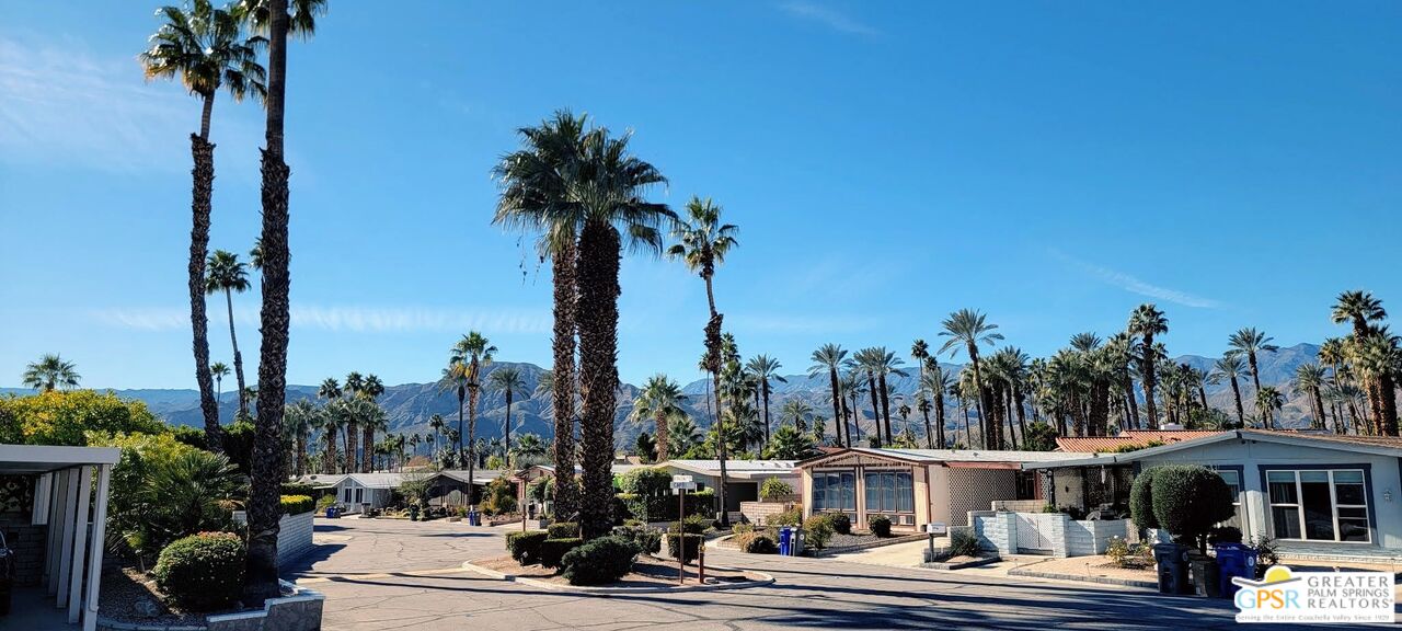 142 Capri Rancho Mirage, CA 92270 - Photo 22 of 26 a front view of a city with tall buildings
