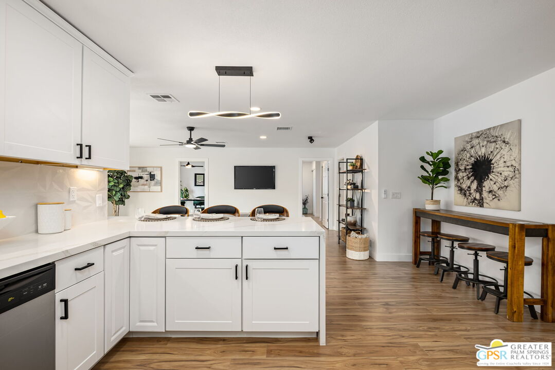 142 Capri Rancho Mirage, CA 92270 - Photo 6 of 26 a kitchen with cabinets a sink and appliances