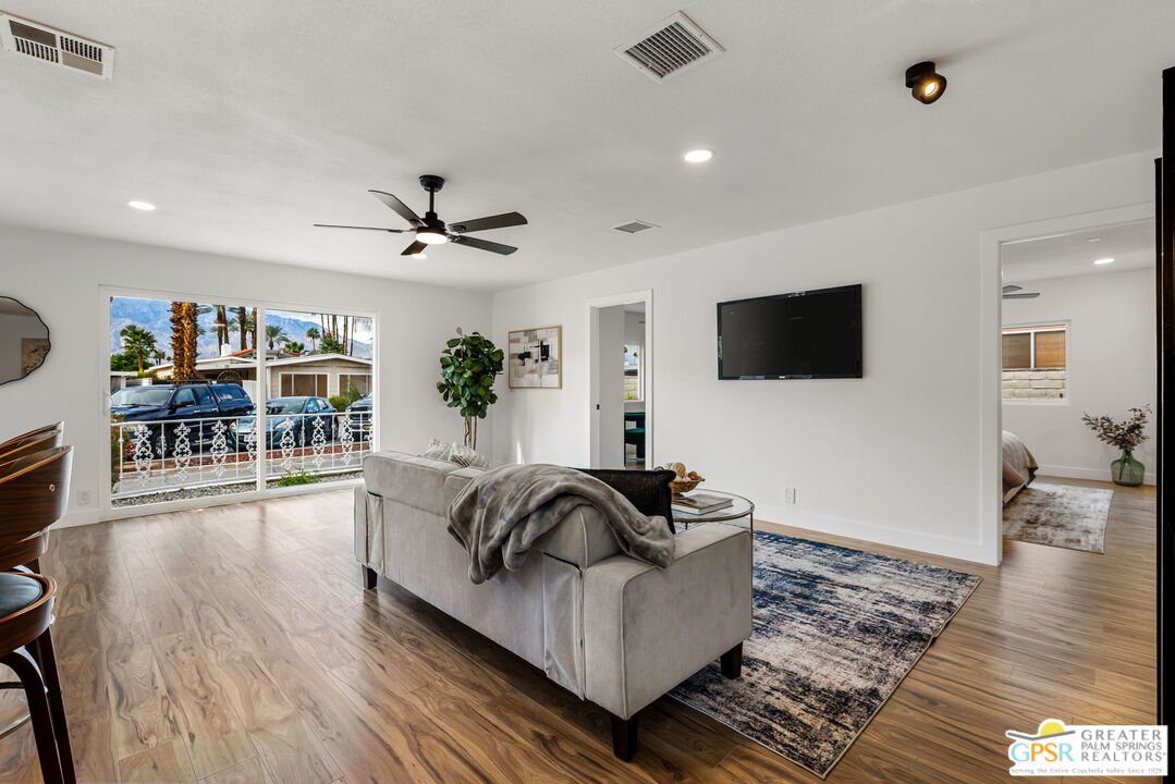 142 Capri Rancho Mirage, CA 92270 - Photo 7 of 26 a living room with furniture and a flat screen tv