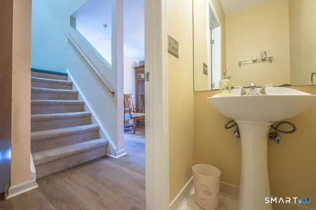 a view of a bathroom with sink and mirror