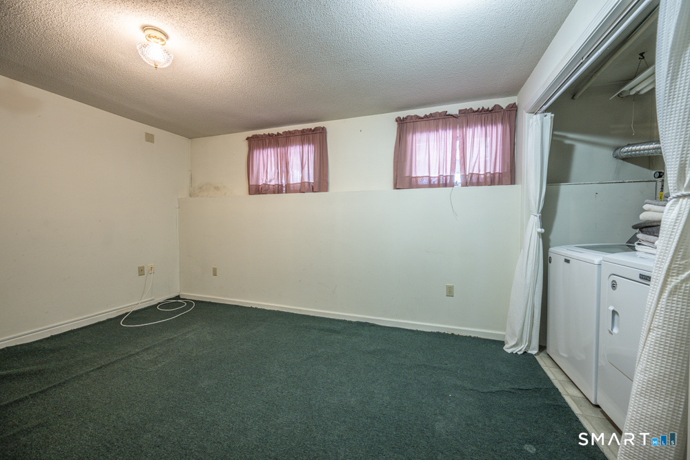 565 Newfield Street, Unit 34 Middletown, CT 06457 - Photo 16 of 17 A space that grows with you. Whether it's fitness, creativity, or quiet focus, this finished basement offers room to make it your own.