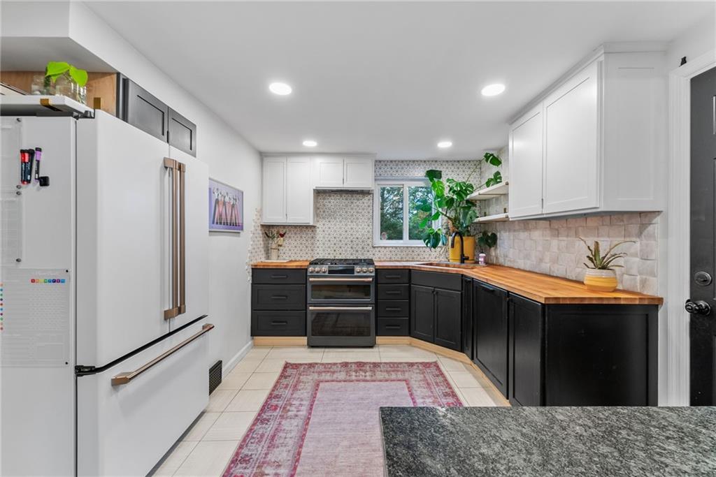 357 Hazel Drive Pittsburgh, PA 15228 - Photo 12 of 39 a kitchen with stainless steel appliances granite countertop a refrigerator and a sink