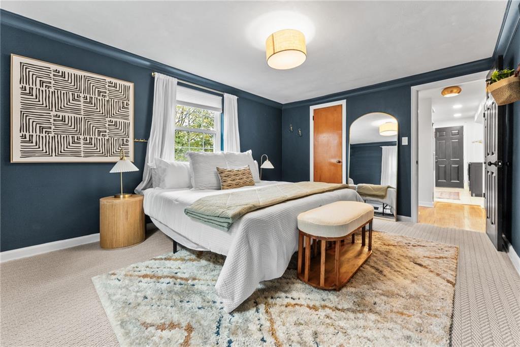 357 Hazel Drive Pittsburgh, PA 15228 - Photo 20 of 39 a bedroom with a bed and dresser with mirror