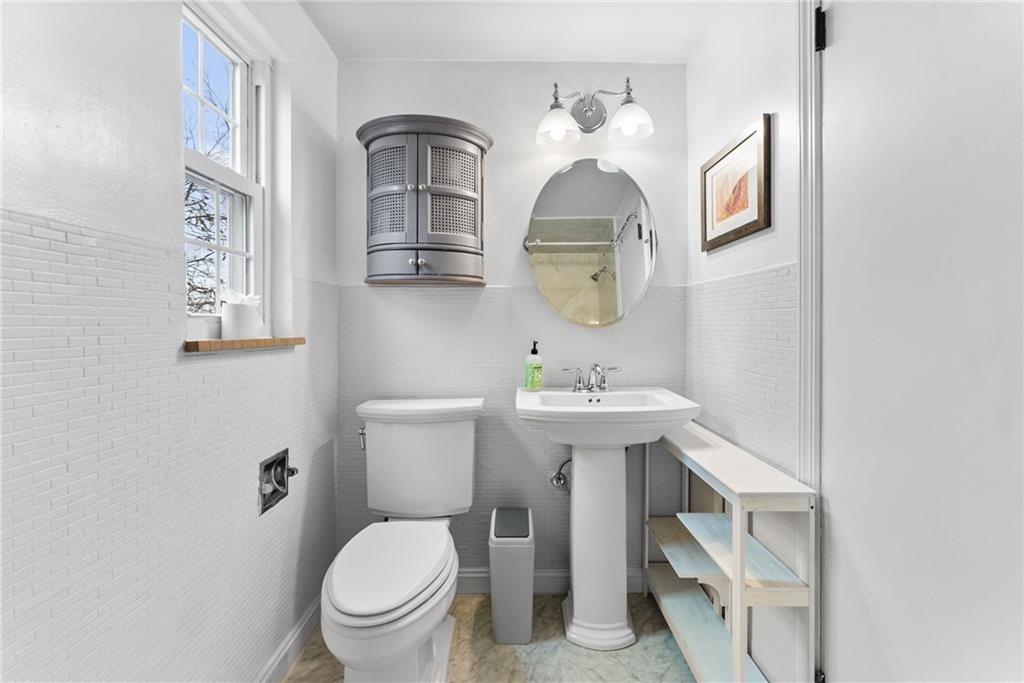 357 Hazel Drive Pittsburgh, PA 15228 - Photo 30 of 39 a bathroom with a toilet a sink and mirror