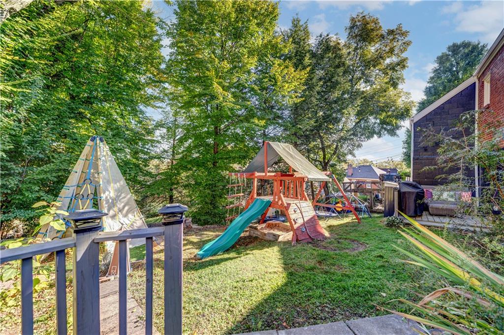 357 Hazel Drive Pittsburgh, PA 15228 - Photo 36 of 39 a view of a house with a yard and trees