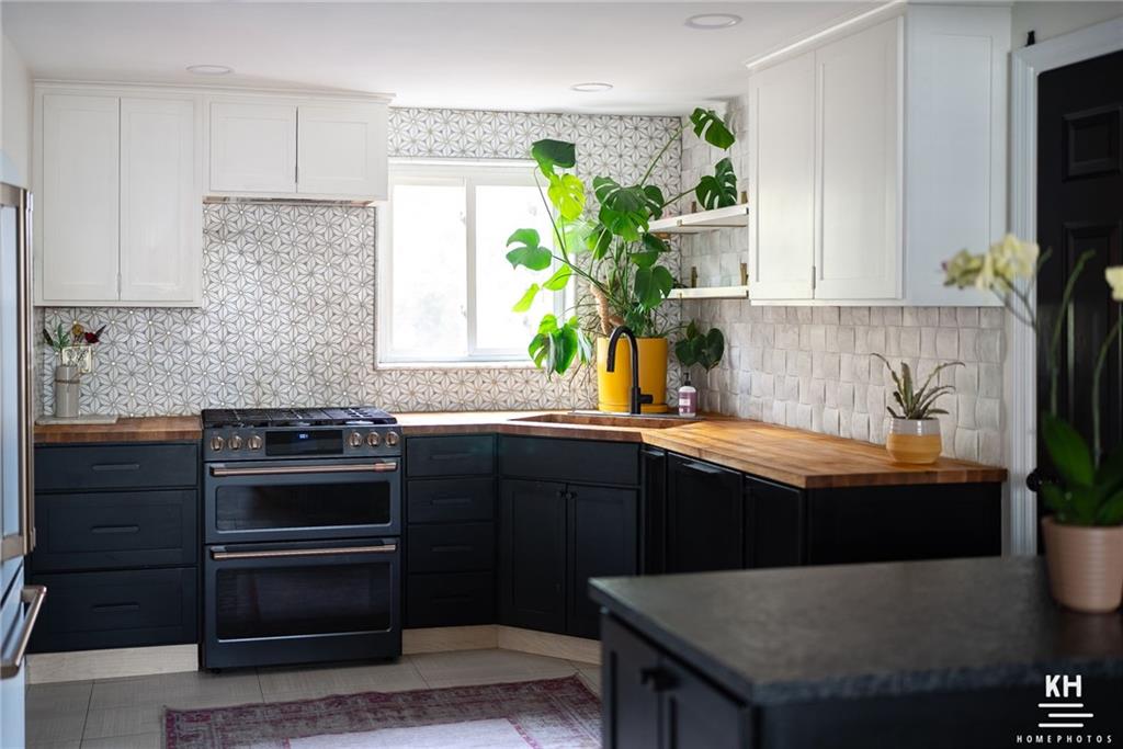 357 Hazel Drive Pittsburgh, PA 15228 - Photo 10 of 39 a kitchen with granite countertop a sink stainless steel appliances and cabinets