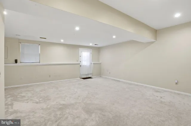 an empty room with a empty space and window