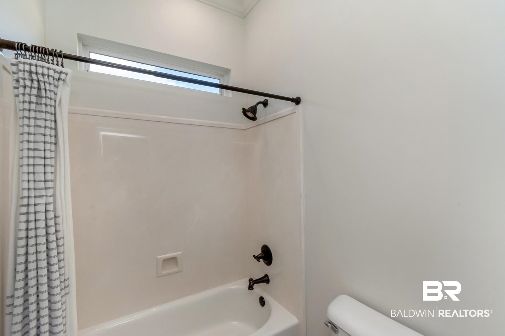 30585 Pine Court Daphne, AL 36527 - Photo 38 of 49 Bathroom featuring shower / bath combo and toilet