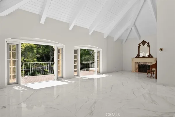 a view of an empty room with balcony