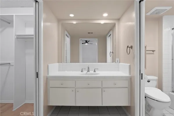 an empty room with windows and entrance