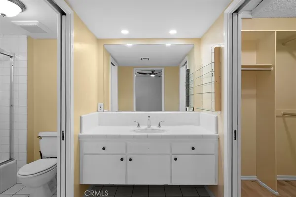 a bathroom with a shower and a toilet