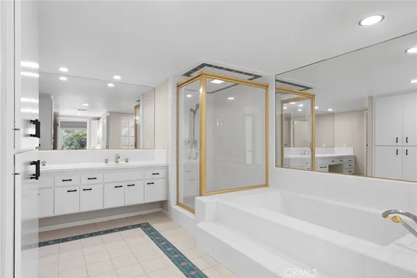 a view of a backyard with table and chairs with a barbeque grill and plants