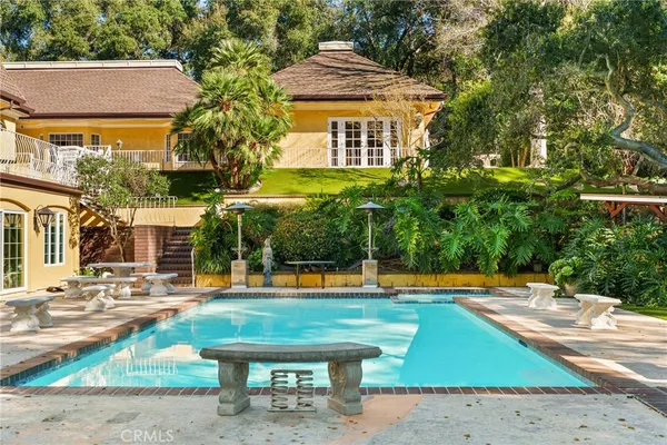 a front view of a house with swimming pool