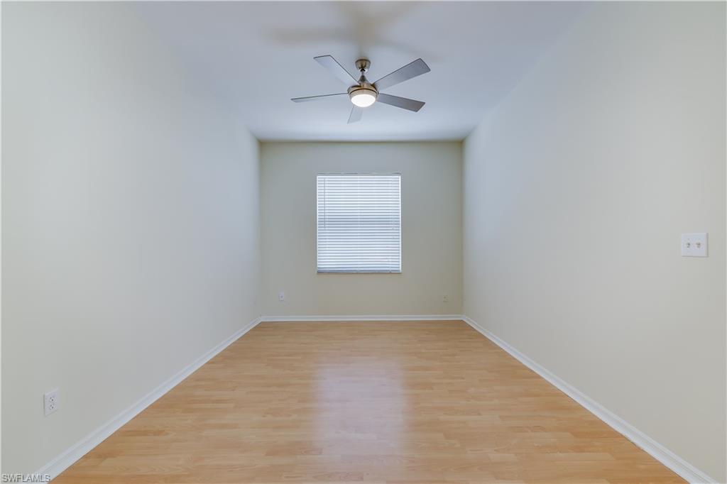 160 Stanhope Circle Naples, FL 34104 - Photo 12 of 17 an empty room with a window and a ceiling fan