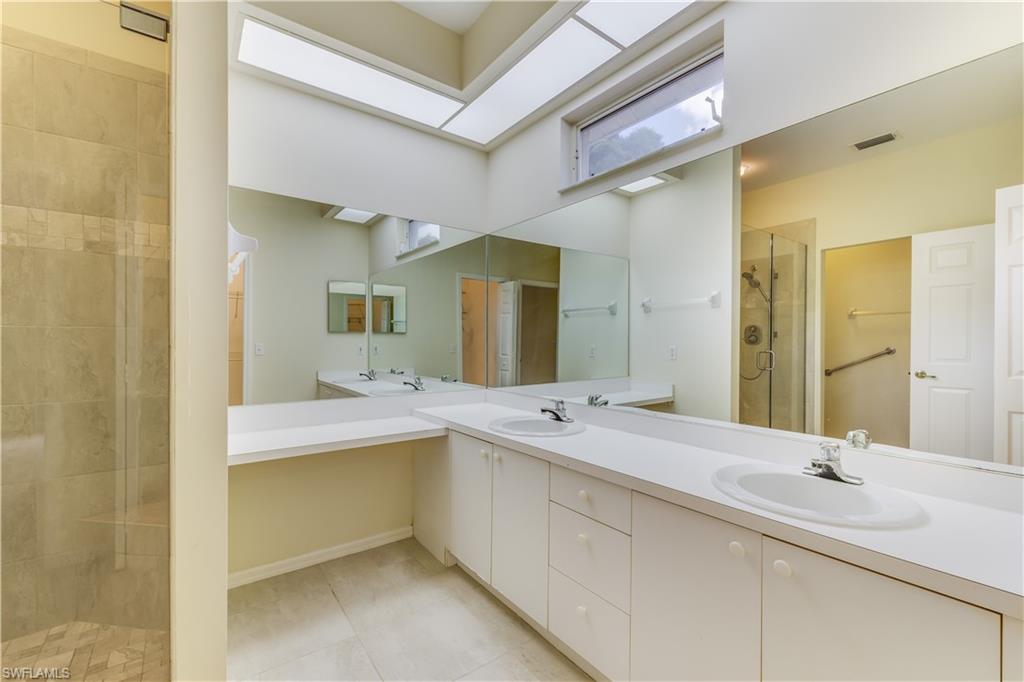 160 Stanhope Circle Naples, FL 34104 - Photo 13 of 17 a bathroom with a granite countertop sink mirror and double