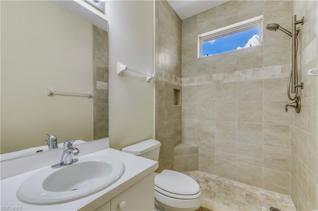 160 Stanhope Circle Naples, FL 34104 - Photo 15 of 17 a bathroom with a sink a toilet and shower