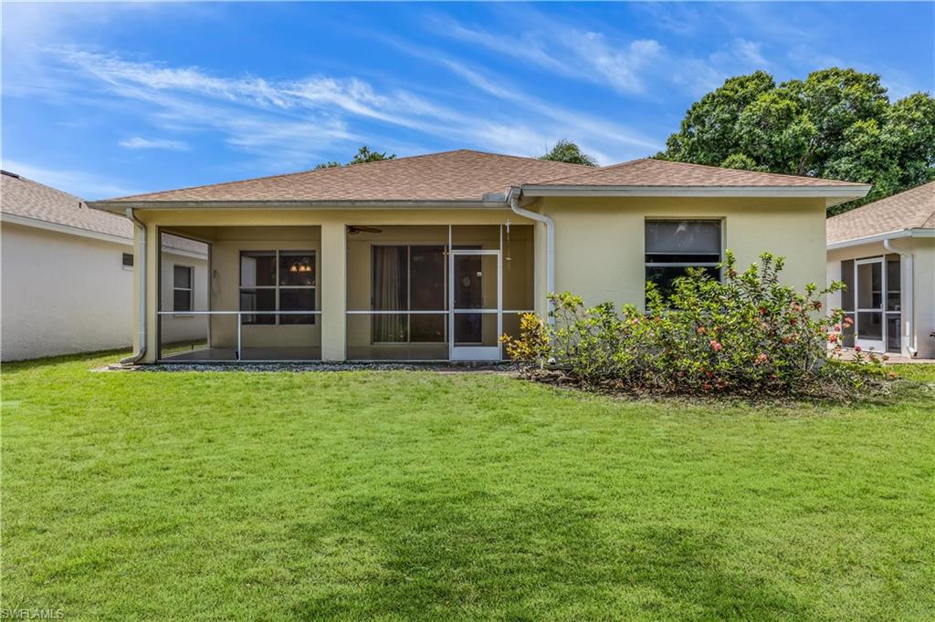 160 Stanhope Circle Naples, FL 34104 - Photo 17 of 17 front view of a house with a garden