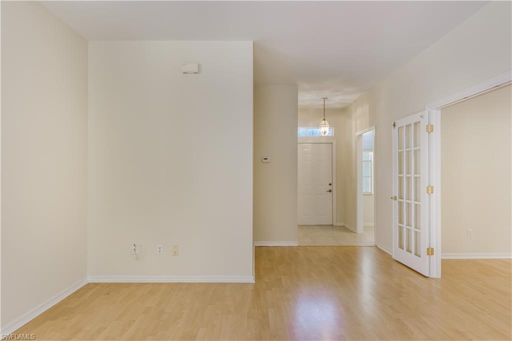160 Stanhope Circle Naples, FL 34104 - Photo 8 of 17 a view of a room with wooden floor