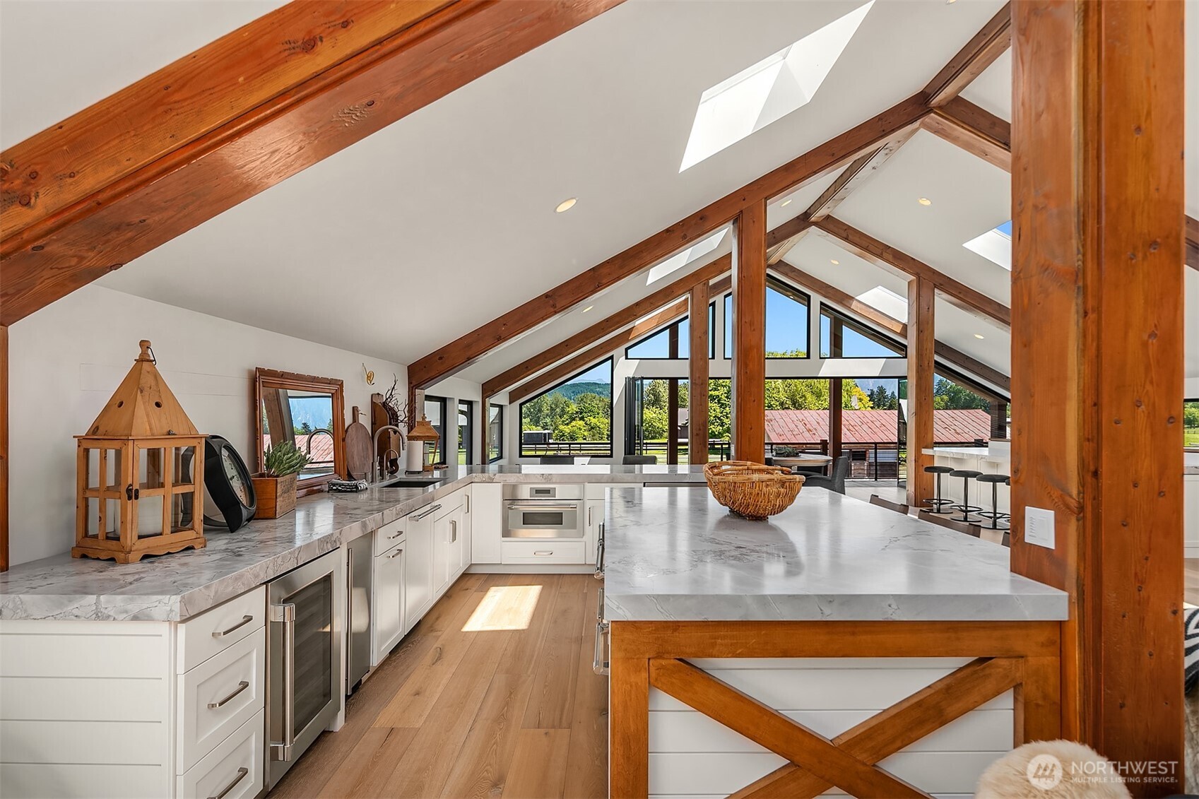 31405 Redmond-Fall City Road Southeast Fall City, WA 98024 - Photo 6 of 32 a kitchen with stainless steel appliances granite countertop a stove and a view of living room