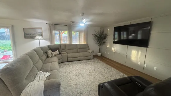 a view of a dining room with furniture and wooden floor