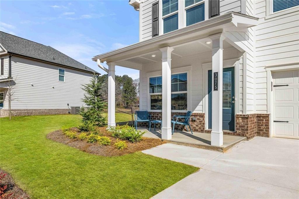 3489 Fairview Road, Unit MAGNOLIA Covington, GA 30016 - Photo 2 of 29 a view of a house with backyard and porch