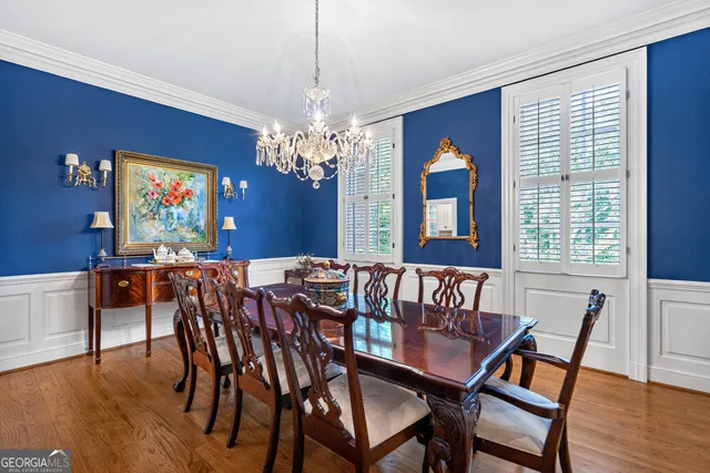 a kitchen with stainless steel appliances granite countertop a stove and a white cabinets